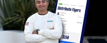 Martin De Anda standing in front of a white wall with his arms crossed, wearing an Airtasker sweatshirt